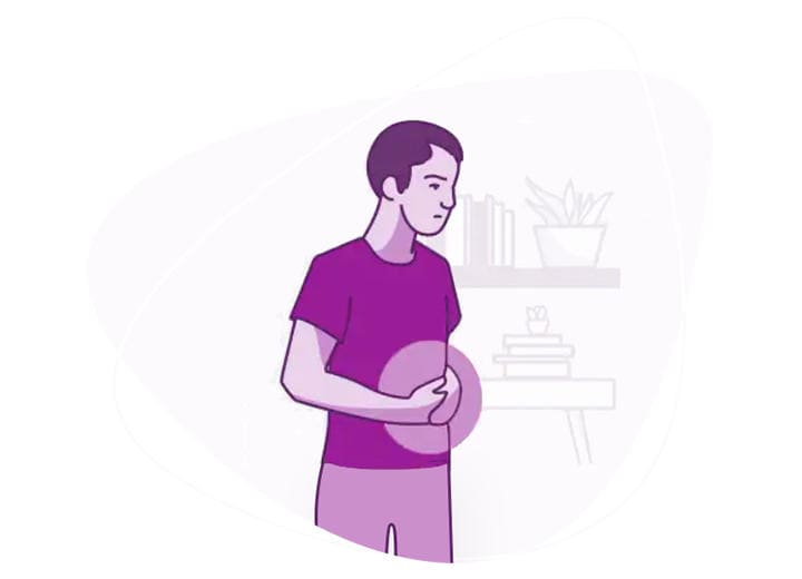 A man with his hands clasped around his stomach in pain from constipation
